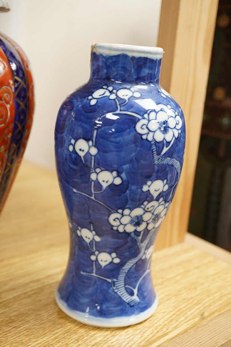 An Imari vase and cover-28cm high, a Chinese jar and prunus vase and a small blue and white jar.